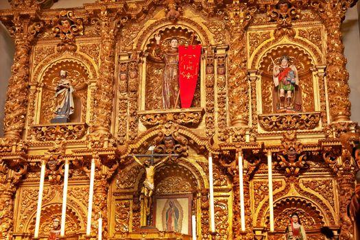 Golden Altar Serra Chapel Mission San Juan Capistrano Church in California.  Father Junipero Serra founded the Mission in 1775, and the altar is 300 years old from Barcelona, Spain.