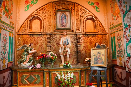 Guadalupe Shrine Mission Basilica San Juan Capistrano Church California. Mexican peasant Juan Diego Statue with Guadalupe on his tunic.