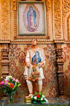 Guadalupe Shrine Mission Basilica San Juan Capistrano Church California. Mexican peasant Juan Diego Statue with Guadalupe on his tunic.