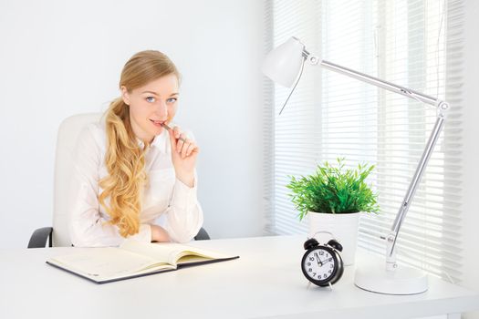 portrait of smiling office girl working at desk