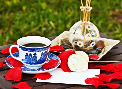 Cup of coffe on the table with a note 