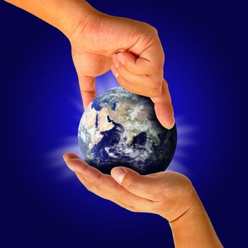Male hand holding the Earth 