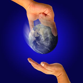 Male hand holding the Earth 