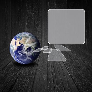 Flying transparent button with earth globe on wood background