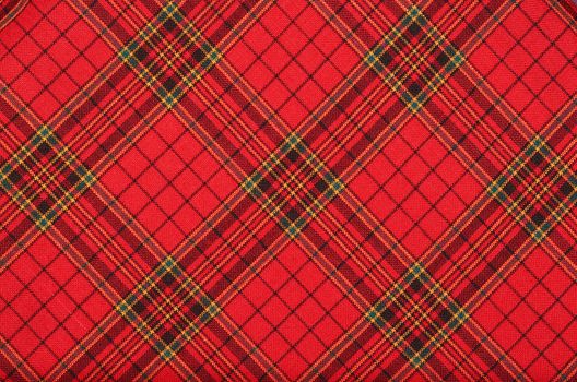 Textiles. Bright red plaid  fabric as natural background