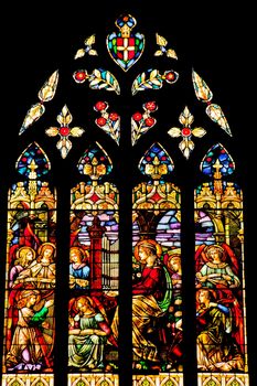 Angels Playing Music Stained Glass in National Shrine of Saint Francis of Assisi San Francisco California.  Church has relics of St Francis.  This church was founded in 1849 and rededicated in 1919 after church was destroyed in 1905 earthquake.