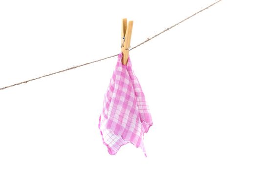 pink handkerchief drying on a rope