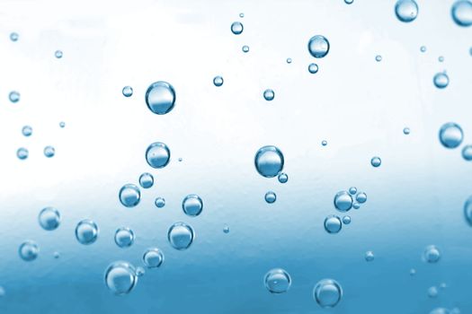 Close up of water drops on blue background