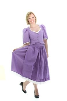 Blond girl and lavender dirndl dress with a full skirt. On white