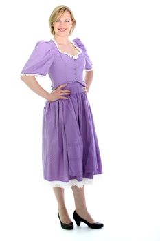 Blond woman wearing a lavender dirndl dress and smiling. On white