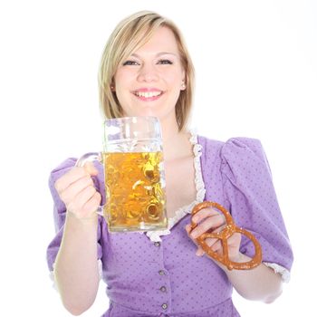 Laughing beautiful blonde girl in a Bavarian style blouse holding up a pint of beer and a pretzel isolated on white