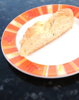 sweet bread with a coconut filling on a plate