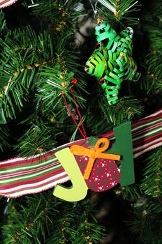 Joy and Star Holiday Ornaments on a Christmas tree