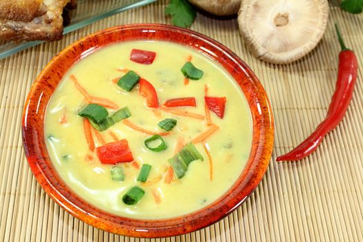 Curry soup with colorful vegetables and chicken