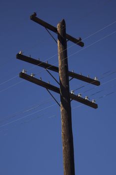 an old power pole with insulators