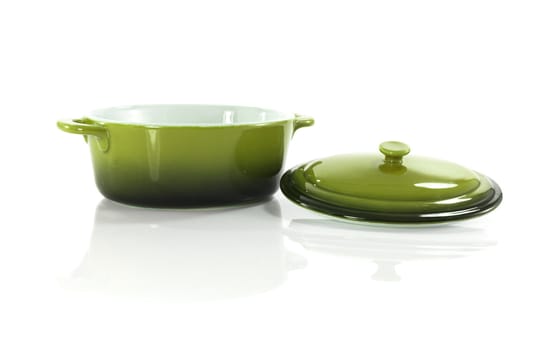 green frying pan isolated on white