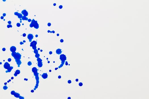 Blue splatter on white background