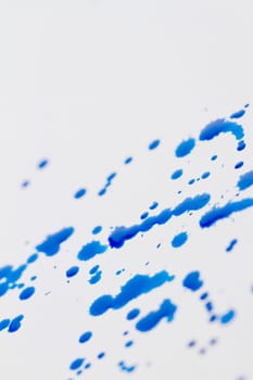 Blue splatter on white background