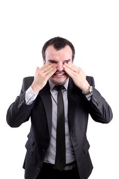 confused businessman rubbing his eyes, isolated on white