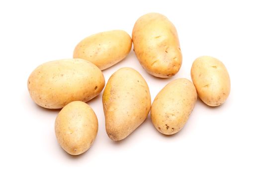 bunch of fresh potatoes against white