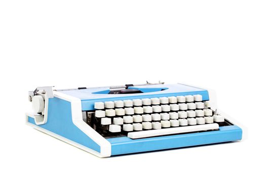 old style typing machine against white background