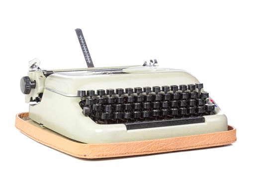 old style typing machine against white background