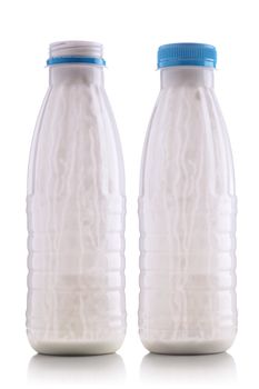 two empty yogurt bottles isolated on white background