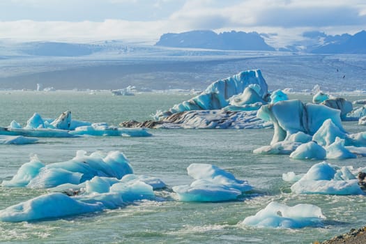 Icebergs in the glacier lake Jokulsarlon, glacier Vatnajokull, Iceland.