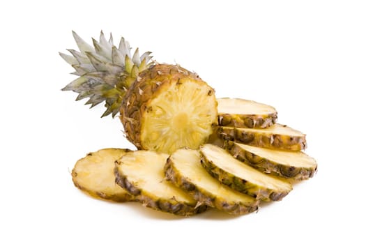 Ripe fruits pineapple with slices isolated on white