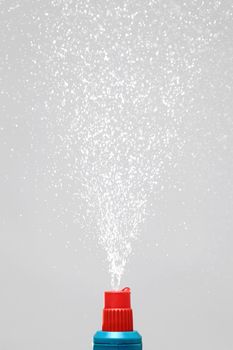 water spray under pressure against gray background