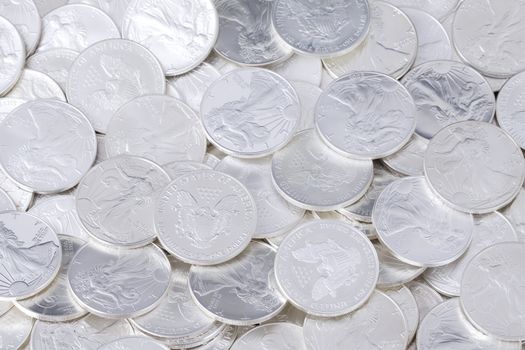 Silver shiny one dollar coins, money background