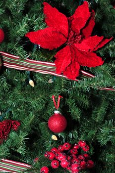 Red Christmas ornaments with a Poinsettia, berries and glass balls