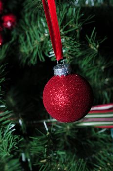 red glitter ornament for the winter holidays