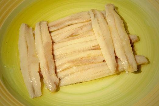 anchovies in a green dish, typical spanish cuisine
