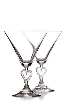 empty martini heart shaped glasses, isolated on white