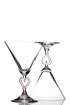 empty martini heart shaped glasses, isolated on white