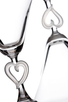 empty martini heart shaped glasses, isolated on white