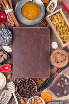 Cover of the book to write prescriptions surrounded ingredients for a sweet holiday baking
