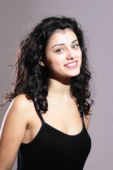 portrait of a young girl on gray background