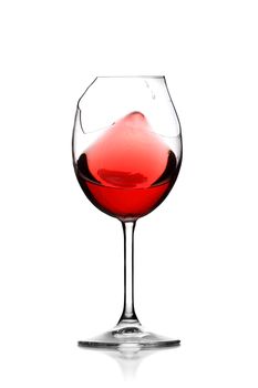 red wine splashing in broken glass, isolated on white