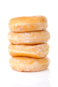 Stacked delicious sugared donuts over white background