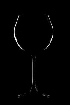 abstract wine glass contour against black background