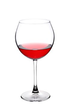 wineglass against white background. half filled with red wine