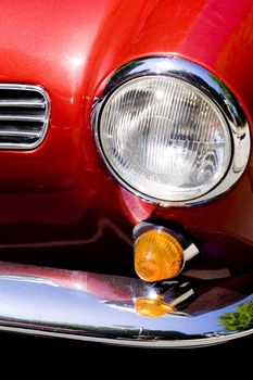 Closeup on headlight of old shiny retro car