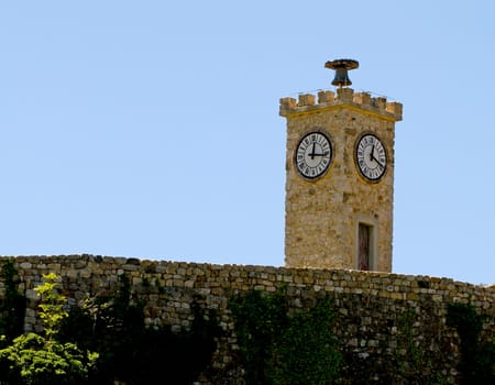 Bell tower in Ardèche France over blue sky