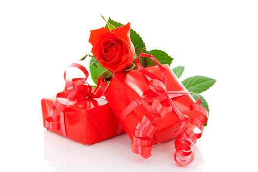 Red presents and rose over white background