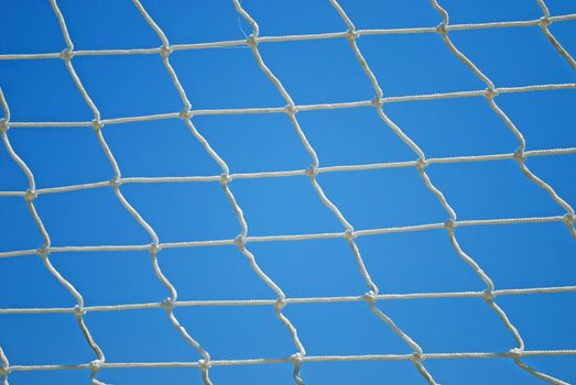 Valleyball Net Strings over Blue Sky Background