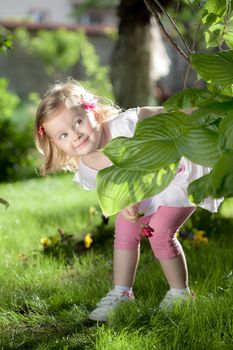 cute little girl playing in the nature