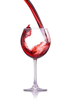 red wine splashing in a glass, isolated on white