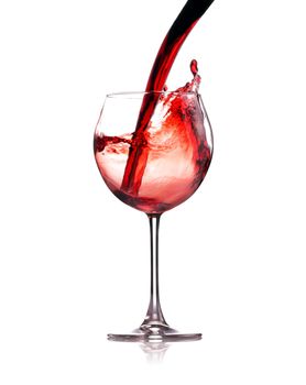 red wine splashing in a glass, isolated on white